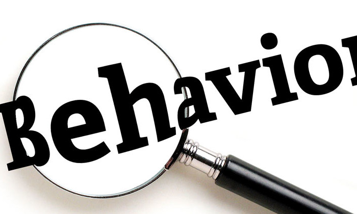 magnifying glass over word "behavior"