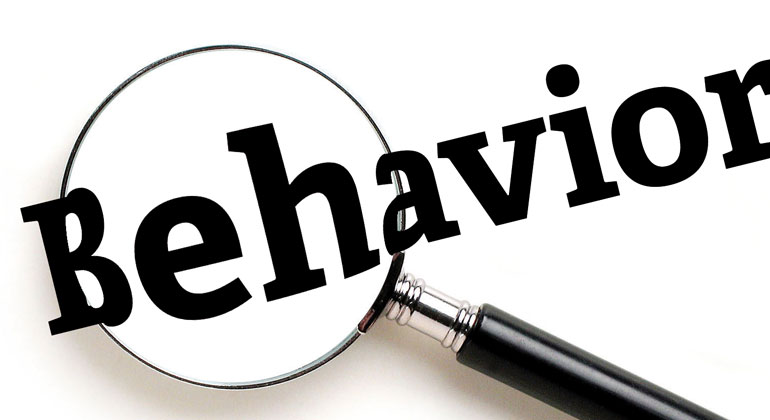 magnifying glass over word "behavior"