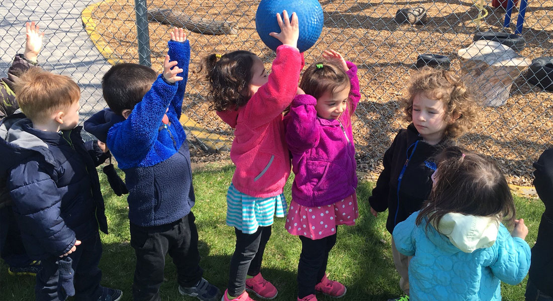 preschoolers playing games outside