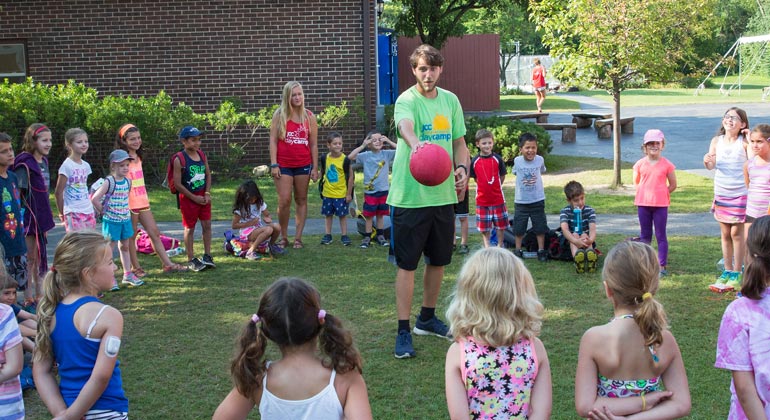 campers and counselors playing game outside