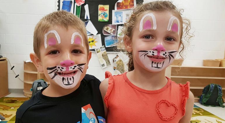 boy and girl with rabbit face paint