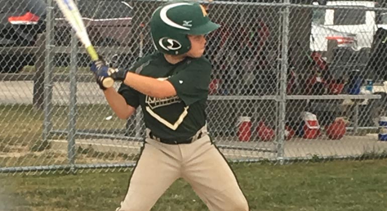 boy playing baseball