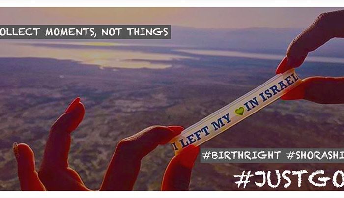 hands holding bracelet that reads "I left my heart in israel"