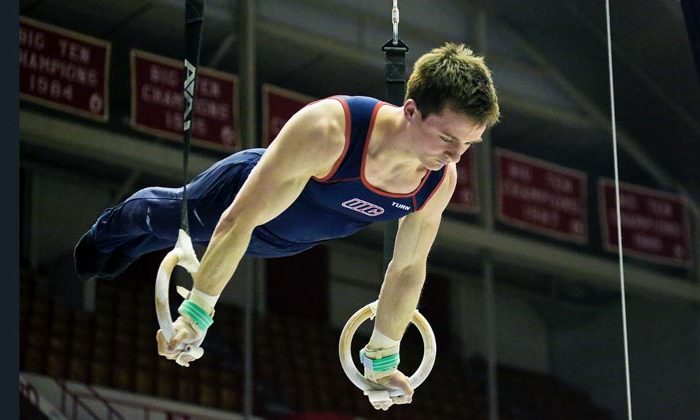 male gymnast on rings