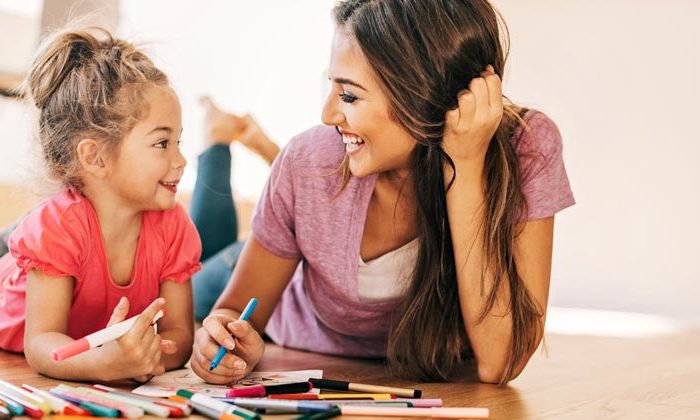 mom and daughter coloring together