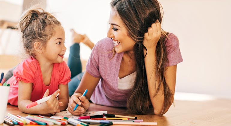 mom and daughter coloring together