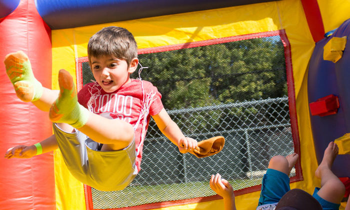 kids playing in bouncy house