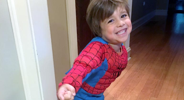 little boy in spider man costume