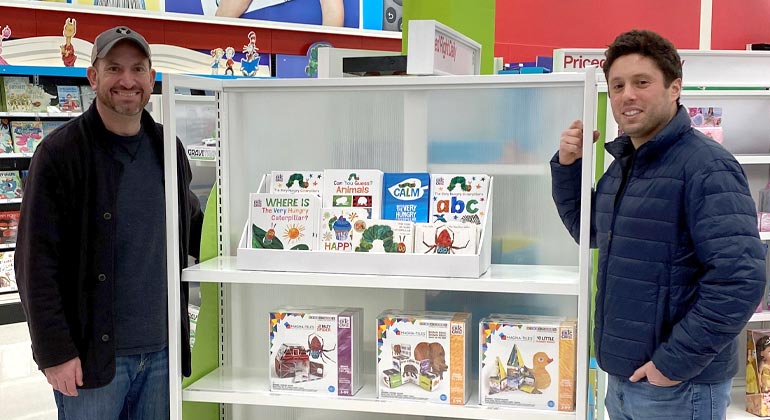 dads at Target next to display of children's books