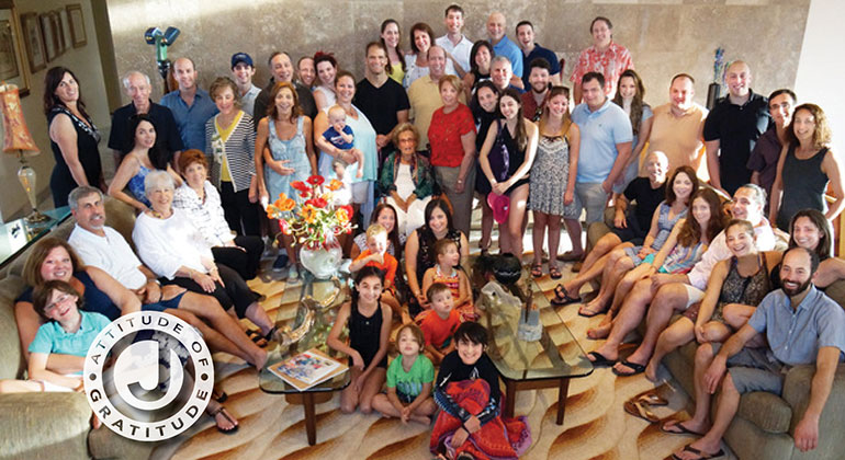 large family smiling for photo