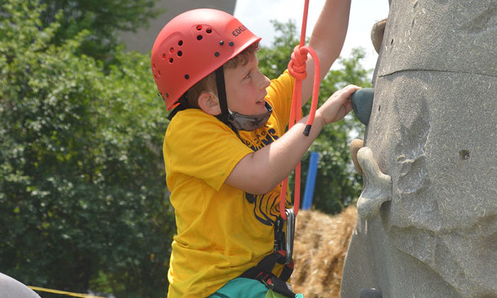 camper rock climbing