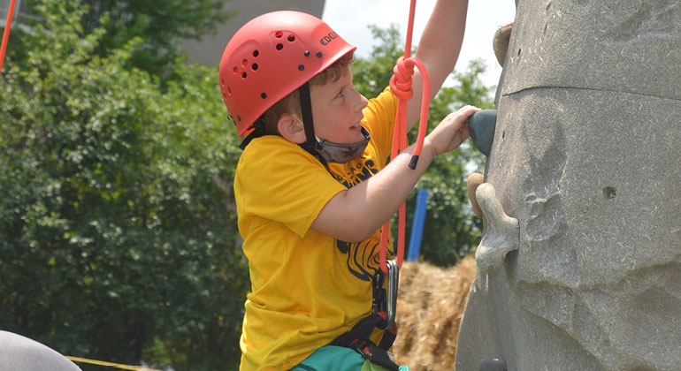 camper rock climbing