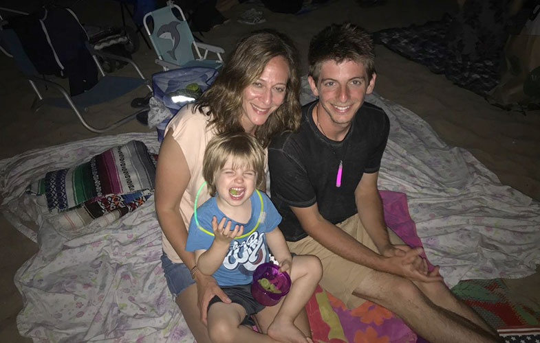 host and counselor with child