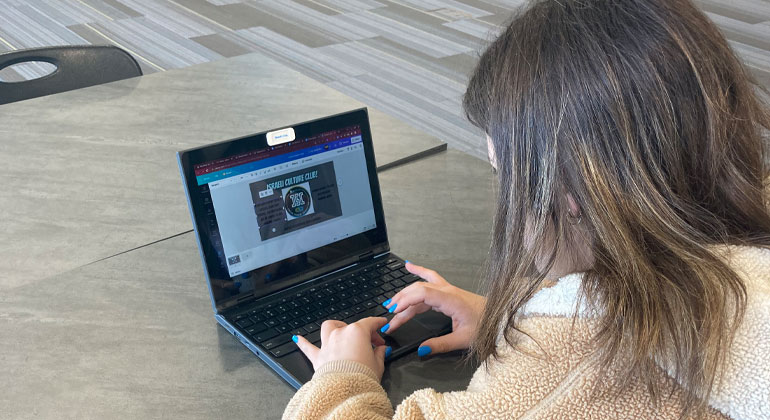 maddie rosengard typing on a computer