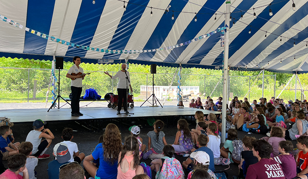 two performers on stage in front of audience