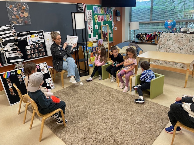 Sam Savin reads Bella Burlap's Brave Adventure during Play Pals group.